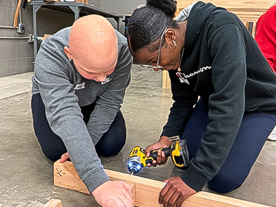 Students building a window frame