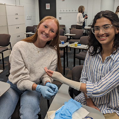 Two students try their hand at casting