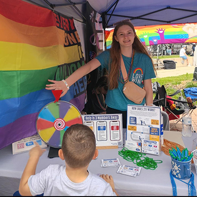 Ava hosting the NAMI booth at Pride Fest